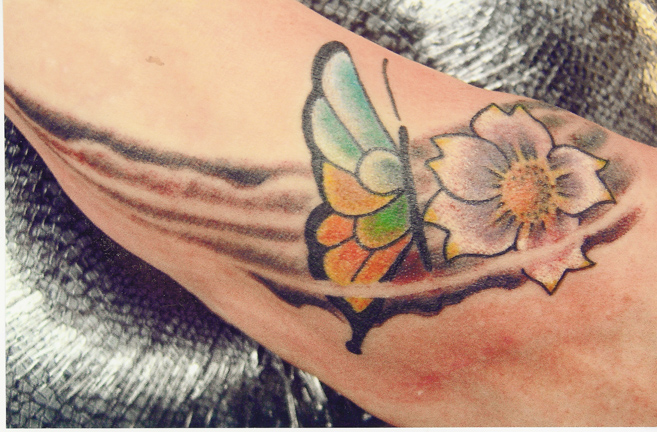 Looking for unique Color tattoos Tattoos?  Butterfly And Flower on foot